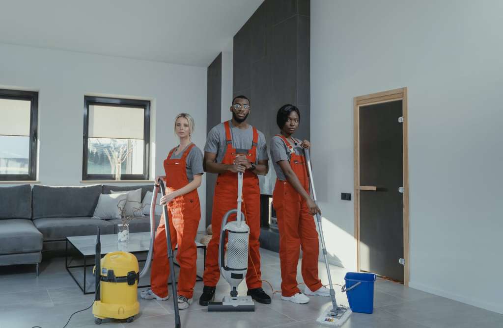 Photo by Tima Miroshnichenko Cleaners in Orange Uniform